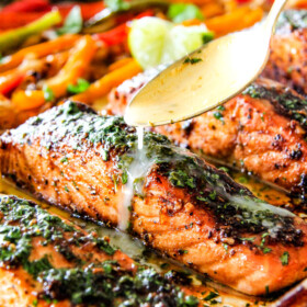 Sheet Pan Fajita Salmon with Cilantro Lime Butter - this salmon is the best I've ever tried! SO flavorful and juicy and the Cilantro Lime Butter is incredible! I serve this with rice and beans for a complete easy, delicious meal!