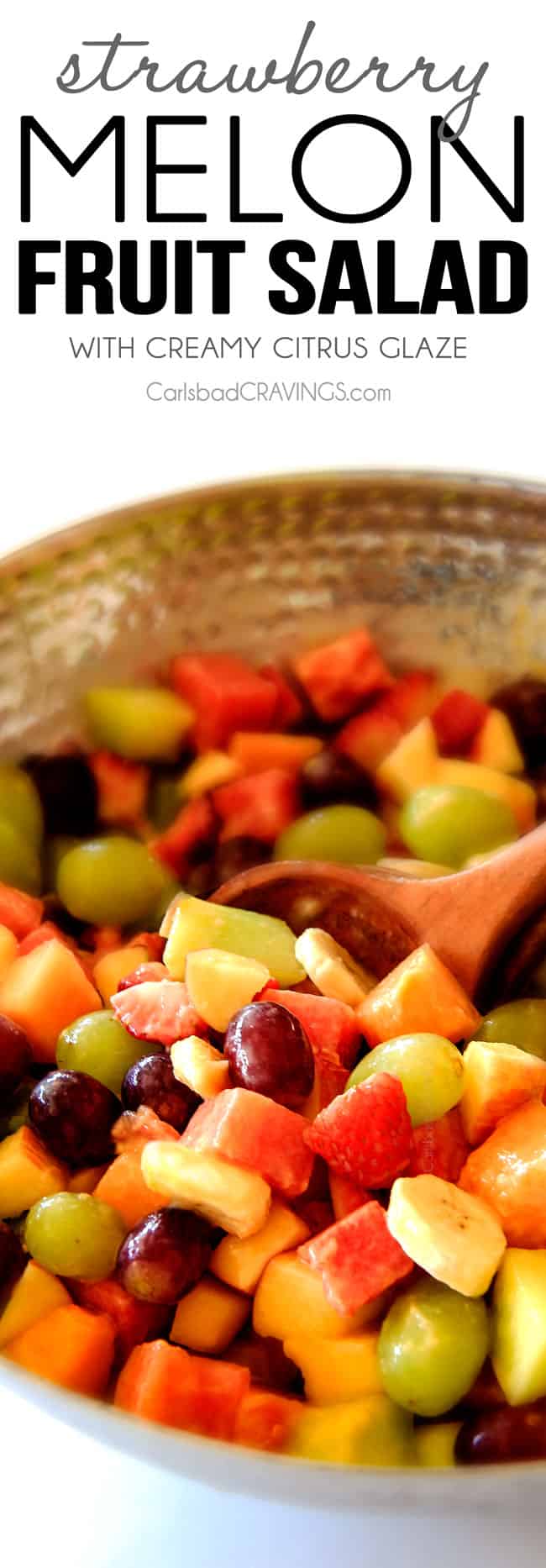 Watermelon Salad with Creamy Citrus Glaze - I took this to a barbecue and it was gone in minutes! Its so cool and refreshing withe the BEST GLAZE and I love the combo of melons, strawberries, bananas, apples and grapes! easy Watermelon Salad in a silver bowl with a servings spoon