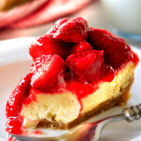 The best Strawberry dessert ever! Strawberry Cheesecake Pie is rich and creamy cheesecake but made extra easy in pie form and extra delicious with vanilla wafer crust! Smother the luscious cheesecake in the BEST sweet glazed strawberries and you won't be able to stop eating!!