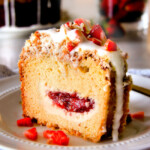 Strawberry Cream Cheese STUFFED Sour Cream Coffee Cake - this is the best strawberry coffee cake ever! the INCREDIBLY creamy cheesecake-like cream cheese filling and strawberries all topped with Coconut Pecan Streusel and Lemon Drizzle is OUT OF THIS WORLD! I can't say enough good things about this coffee cake!