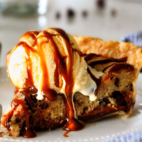 make ahead Million Dollar Cookie Pie layered with Nutella, Dulce de Leche and cookie dough! This is hands down the best skillet cookie I've ever made and its always such a crowd pleaser!