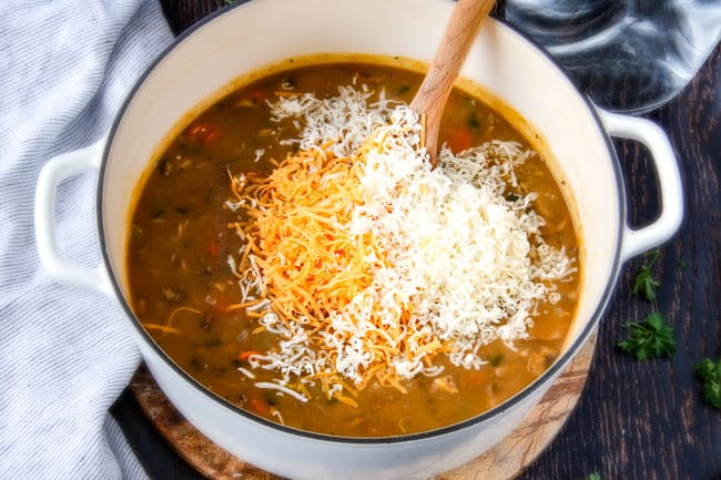 Showing how to make Philly Cheesesteak Soup adding cheese.