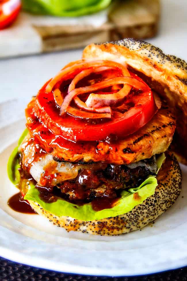 Amazingly juicy Hawaiian Burgers BURSTING with flavor, smothered in Havarti cheese, more Hawaiian Sauce and topped with caramelized pineapple. This might be the best burger. EVER!