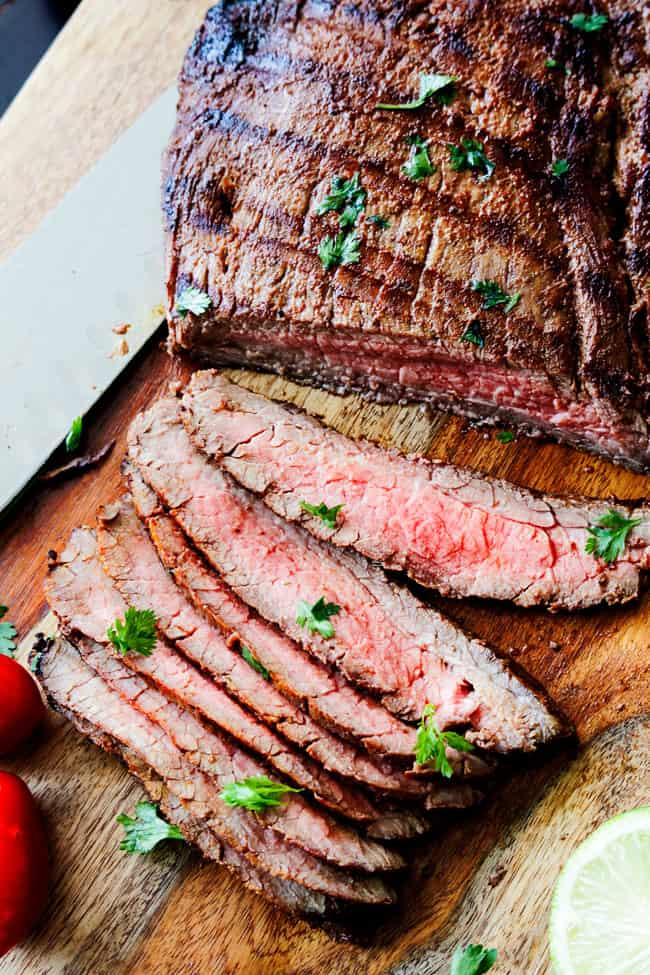 showing how to make steak fajitas by thinly slicing steak