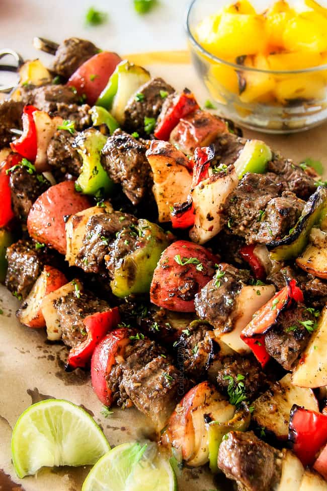 Close up of Brazilian Steak Kabobs with potatoes on the kabobs.