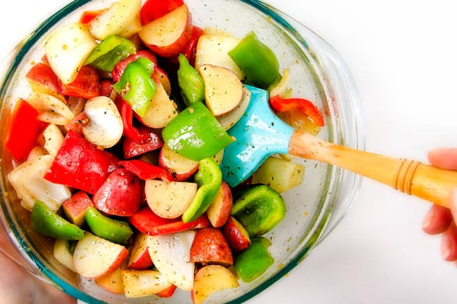 Showing how to make Brazilian Steak Kabobs mixing vegetables.