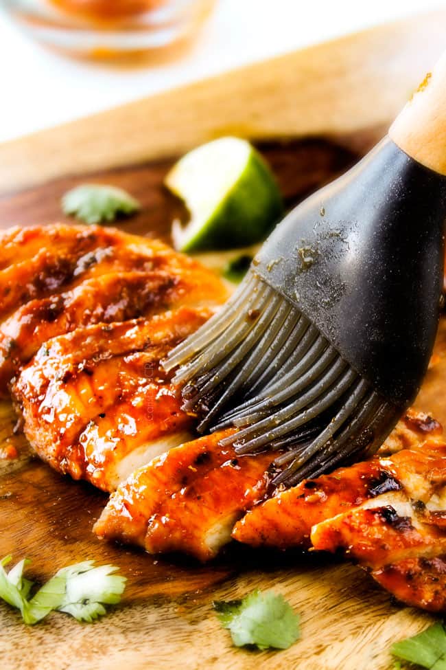 These are ADDICTINGLY DELICIOUS! Honey Chipotle Chicken Tacos stuffed with wonderfully juicy, flavor packed Honey Chipotle Bacon Chicken (yes BACON chicken!), piled with crispy BLT Slaw and creamified with Cilantro Lime Crema! glazing chipotle chicken for honey chipotle chicken tacos