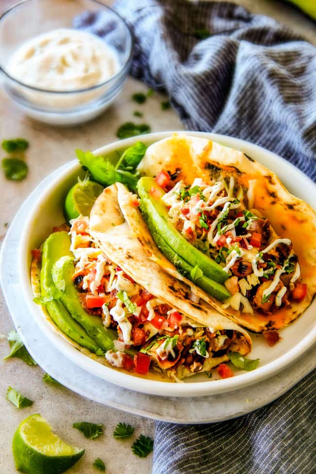 showing how to serve chipotle tacos by piling with BLT slaw