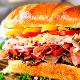 Easy, customizable LOADED Slow Cooker Italian Beef Sandwiches are crazy tender, seeping with flavor and unbelievably delicious! They make the easiest dinner or party food and super fun (make ahead!) sandwich bar!