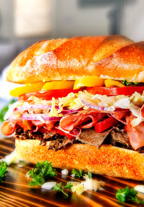 Easy, customizable LOADED Slow Cooker Italian Beef Sandwiches are crazy tender, seeping with flavor and unbelievably delicious! They make the easiest dinner or party food and super fun (make ahead!) sandwich bar!  