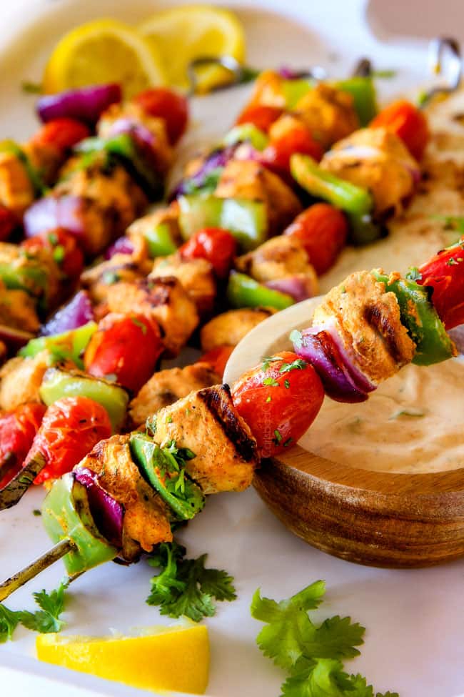 Tandoori Chicken Kabobs with dipping sauce.