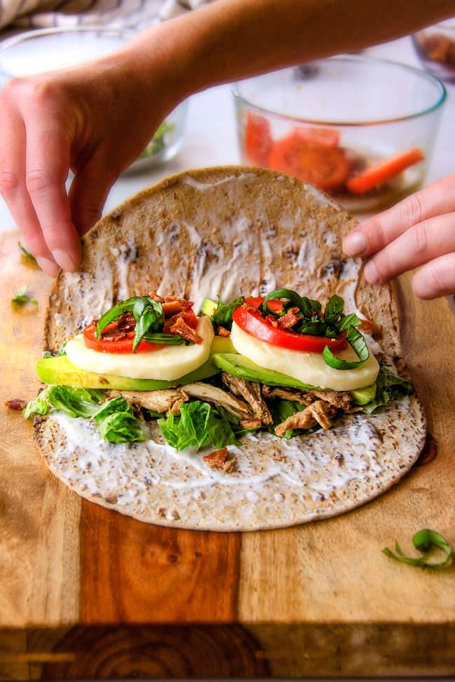 15 MINUTE Avocado Caprese Chicken Wraps - I am completely addicted to these wraps and they are totally easy and healthy! they are loaded with the most amazing balsamic chicken, juicy tomatoes, milky mozzarella, creamy avocadoes, crunchy romaine, fresh basil and crispy bacon all wrapped in a soft flatbread. seriously, to die for!