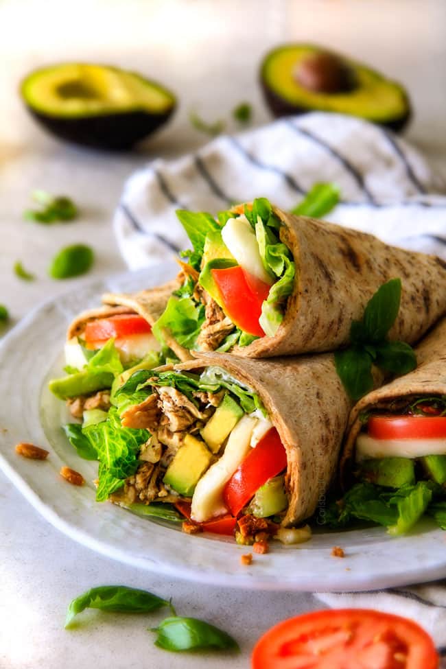 15 MINUTE Avocado Caprese Chicken Wraps - I am completely addicted to these wraps and they are totally easy and healthy! they are loaded with the most amazing balsamic chicken, juicy tomatoes, milky mozzarella, creamy avocadoes, crunchy romaine, fresh basil and crispy bacon all wrapped in a soft flatbread. seriously, to die for!