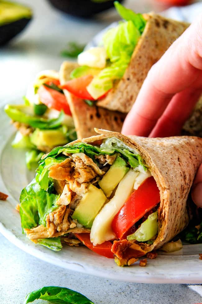 15 MINUTE Avocado Caprese Chicken Wraps - I am completely addicted to these wraps and they are totally easy and healthy! they are loaded with the most amazing balsamic chicken, juicy tomatoes, milky mozzarella, creamy avocadoes, crunchy romaine, fresh basil and crispy bacon all wrapped in a soft flatbread. seriously, to die for!