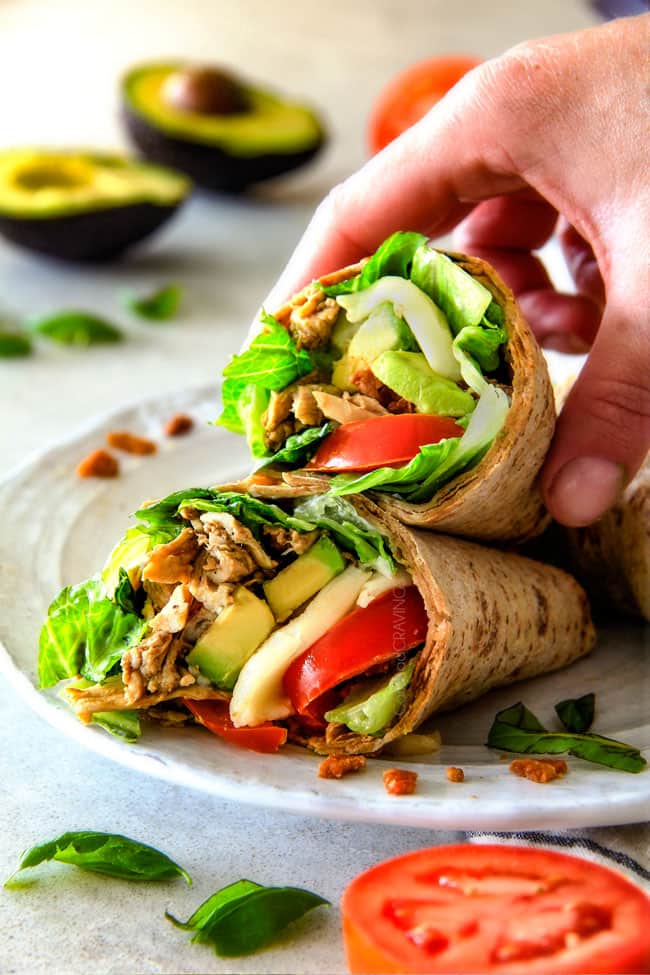 15 MINUTE Avocado Caprese Chicken Wraps - I am completely addicted to these wraps and they are totally easy and healthy! they are loaded with the most amazing balsamic chicken, juicy tomatoes, milky mozzarella, creamy avocadoes, crunchy romaine, fresh basil and crispy bacon all wrapped in a soft flatbread. seriously, to die for!