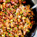 These EASY Baked or Grilled Cheesy Bacon Potatoes are so ADDICTING!  they are perfectly spiced, ssooooo cheesy and I love the soft centers and crispy edges!  Tastes like potato skins but better!   