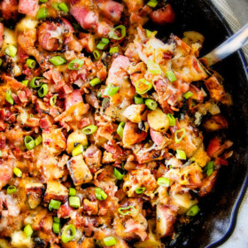 These EASY Baked or Grilled Cheesy Bacon Potatoes are so ADDICTING! they are perfectly spiced, ssooooo cheesy and I love the soft centers and crispy edges! Tastes like potato skins but better!