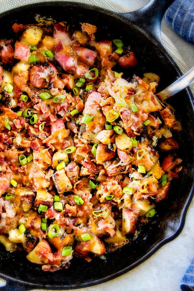 These EASY Baked or Grilled Cheesy Potatoes with Bacon are so ADDICTING! they are perfectly spiced, ssooooo cheesy and I love the soft centers and crispy edges! Tastes like potato skins but better!