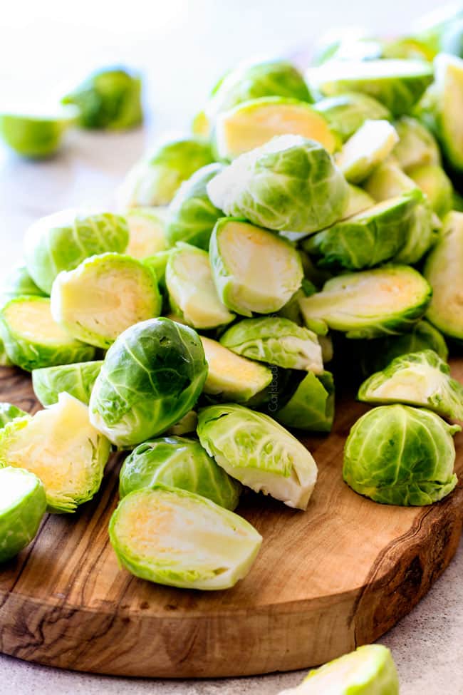 These nutty, caramelized 15 Minute Brussels Sprouts sauteed with garlic, butter and lemon are one of my favorite sides ever and I love the steaming trick for even cooking! showing how to trim Brussels sprouts for Sautéed Brussels Sprouts recipe