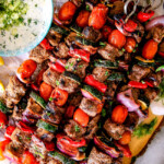 These easy Baked or Grilled Greek Beef Kabobs are so crazy juicy and exploding with flavor in every mouthwatering bite!  And the creamy, refreshing Whipped Feta Whipped Feta Tzatziki Dip is out of this world!  