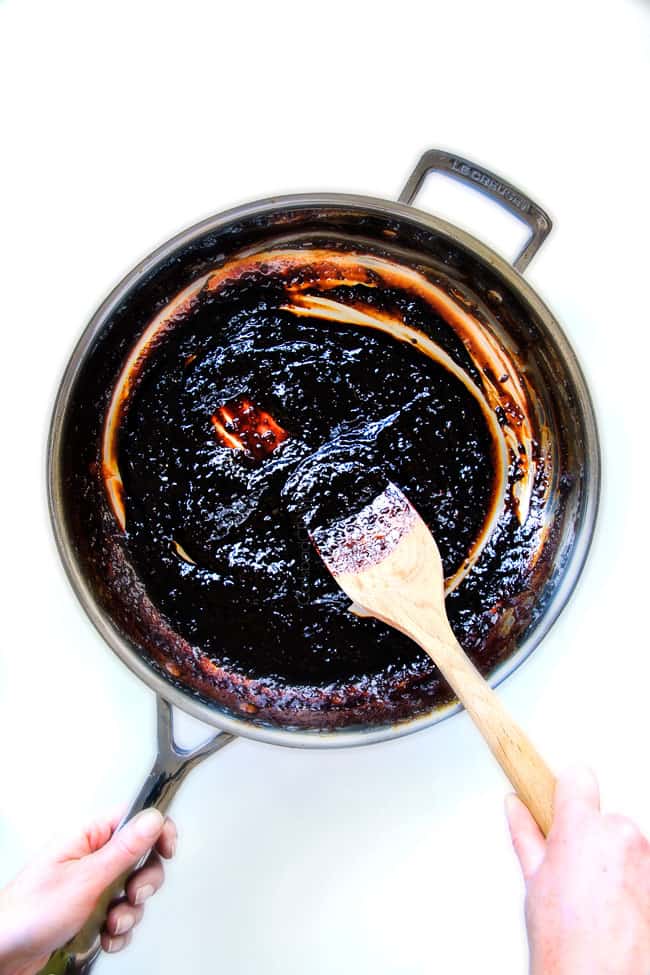 I am obsessed with this sweet and tangy, savory Slow Cooker Honey Balsamic Beef!!! It's fall apart tender, crazy juicy, packed with flavor and smothered in the most AMAZING honey balsamic sauce! perfect for sandwiches or stand alone delicious with rice and potatoes! showing how to make slow cooker roast beef by reducing sauce in a skillet