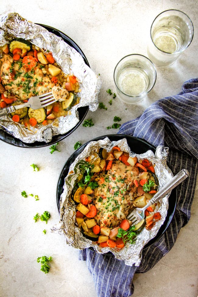 Baked or Grilled Italian Mozzarella Chicken Foil Packets are bursting with astonishingly juicy, flavorful chicken and tender, seasoned Potatoes, Carrots and Zucchini all smothered with Mozzarella Cheese! These foil packets are meal-in-one that are quick to throw together and even quicker to clean up!