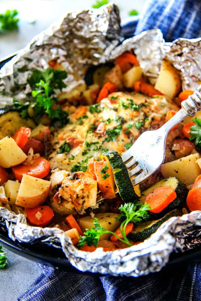 Baked or Grilled Italian Mozzarella Chicken Foil Packets are bursting with astonishingly juicy, flavorful chicken and tender, seasoned Potatoes, Carrots and Zucchini all smothered with Mozzarella Cheese! These foil packets are meal-in-one that are quick to throw together and even quicker to clean up!
