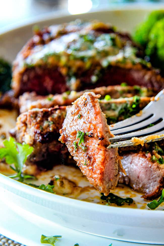 close up of slice of sirloin steak covered in spice rub
