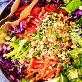This Crunchy Asian Salad with Sriracha peanut Dressing is CRAZY GOOD! The combination of texures is amazing and the dressing is absolutely addicting! This salad is so good I was actually eating leftovers for breakfast!