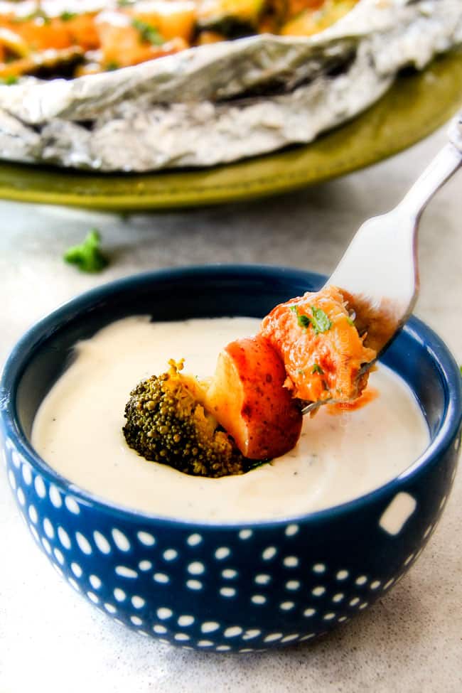 EASY Baked or Grilled Cheesy Buffalo Chicken Foil Packets bursting with juicy chicken and tender, flavorful veggies all smothered in cheddar and dipped in Ranch Crema! these are SO addictingly delicious!!!