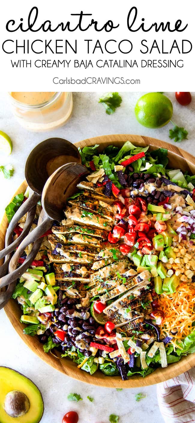 I couldn't stop eating this Cilantro Lime Chicken Taco Salad! Its bursting with tender, juicy chicken and the sweet & tangy Creamy Baja Catalina Dressing is out of this world delicious! This combo is pure heaven! top view of chicken taco salad with black beans and corn in a wooden bowl