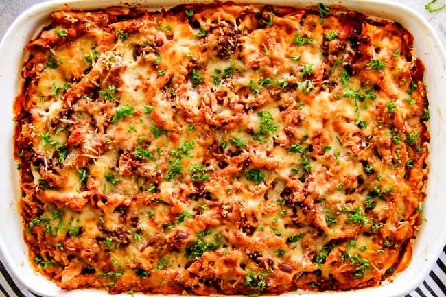 This Million Dollar Baked Penne has been a family favorite for decades! We serve it at all our family gatherings because its SO good, so easy! The homemade sauce is incredible and the hidden layer of creamy/cheesiness is to live for!