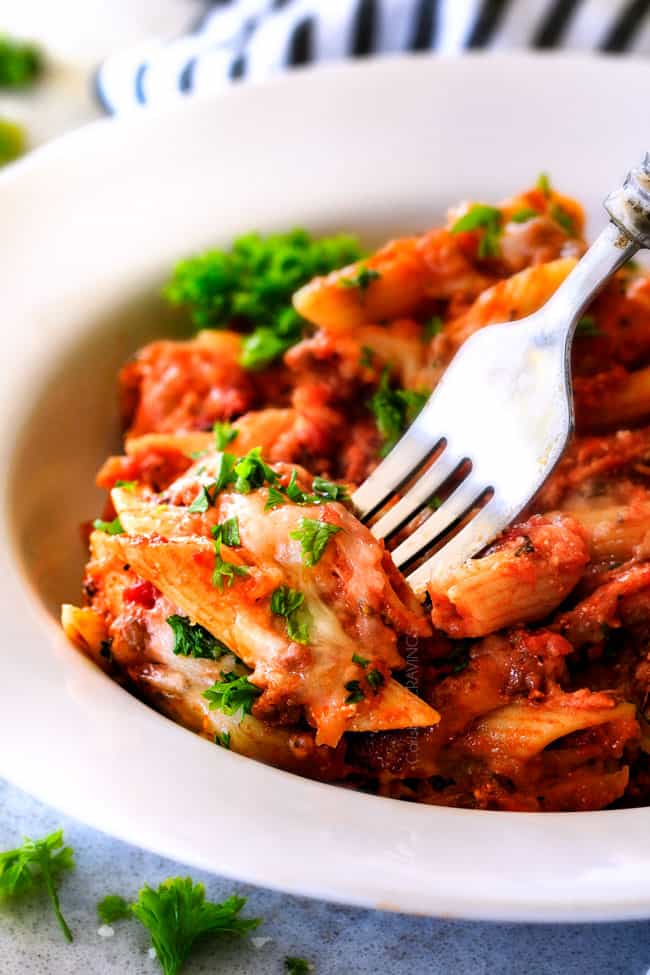 This Million Dollar Baked Penne has been a family favorite for decades! We serve it at all our family gatherings because its SO good, so easy! The homemade sauce is incredible and the hidden layer of creamy/cheesiness is to live for!