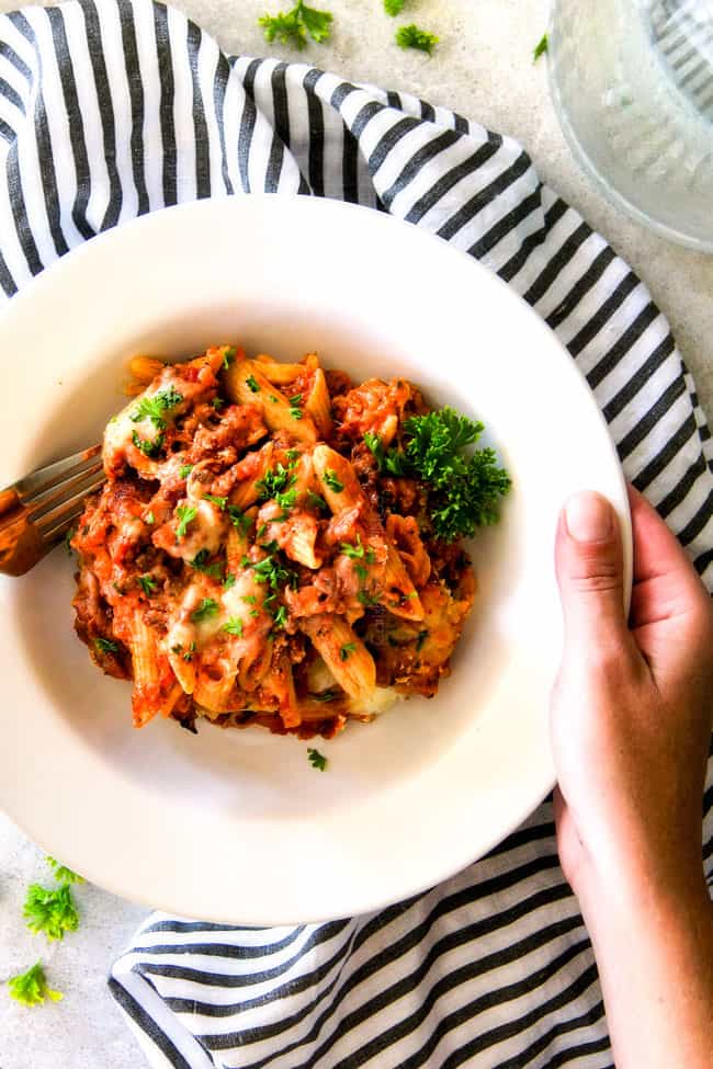 This Million Dollar Baked Penne has been a family favorite for decades! We serve it at all our family gatherings because its SO good, so easy! The homemade sauce is incredible and the hidden layer of creamy/cheesiness is to live for!