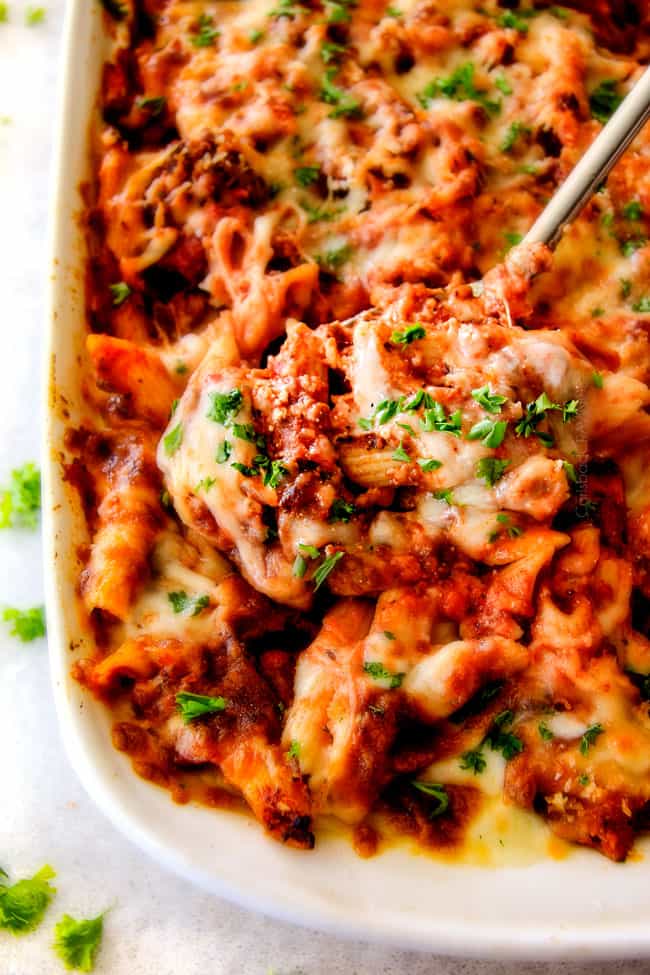 This Million Dollar Baked Penne has been a family favorite for decades! We serve it at all our family gatherings because its SO good, so easy! The homemade sauce is incredible and the hidden layer of creamy/cheesiness is to live for!