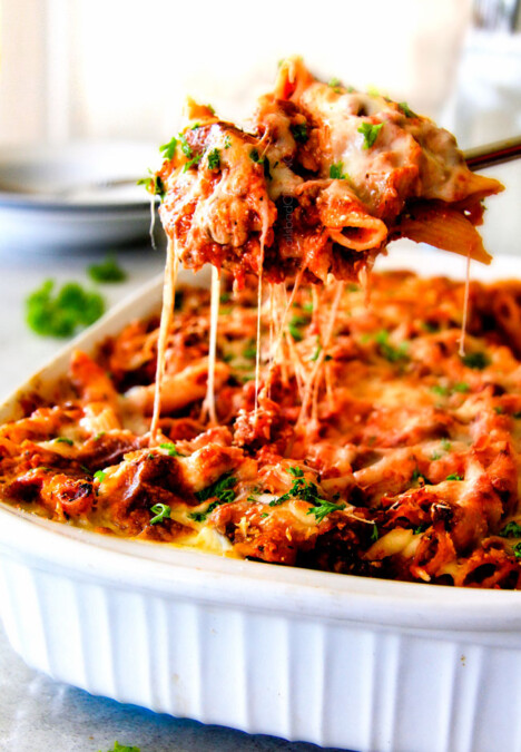 This Million Dollar Baked Penne has been a family favorite for decades!  We serve it at all our family gatherings because its SO good, so easy!  The homemade sauce is incredible and the hidden layer of creamy/cheesiness is to live for! 