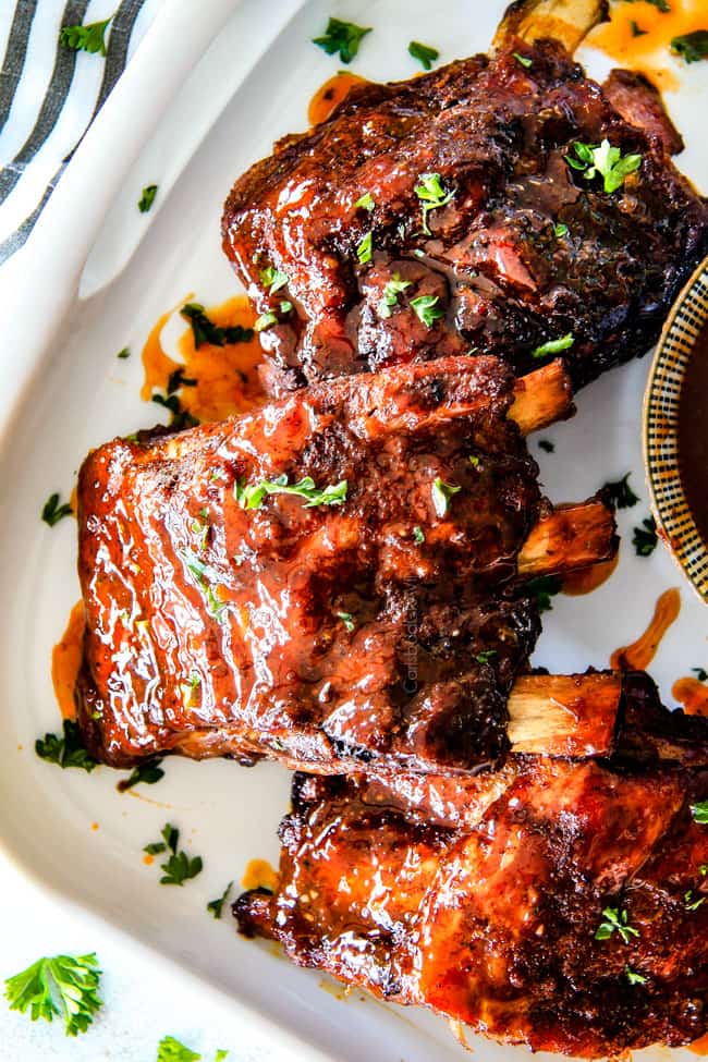 Slow Cooker Honey Buffalo Ribs on a white plate.