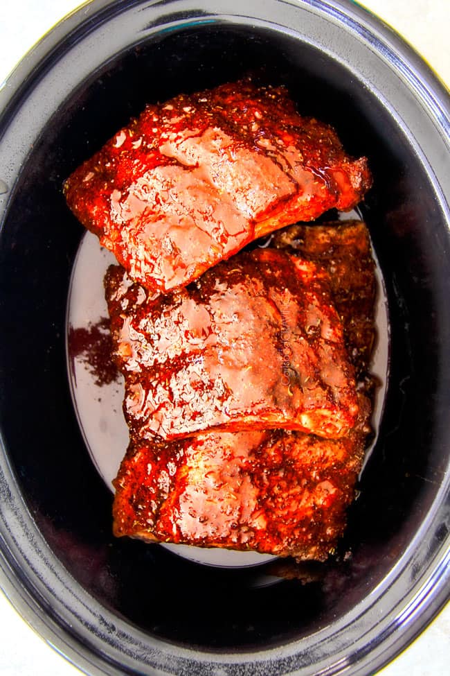 Slow Cooker Honey Buffalo Ribs cooking in the pot.