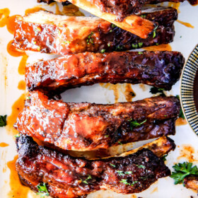 15 minute prep Fall-Off-the-Bone Slow Cooker HONEY BUFFALO Ribs that everyone goes crazy for! Â These are SO tender and SO easy! Â They are slathered in an amazing rub and the most addicting honey buffalo sauce ever!