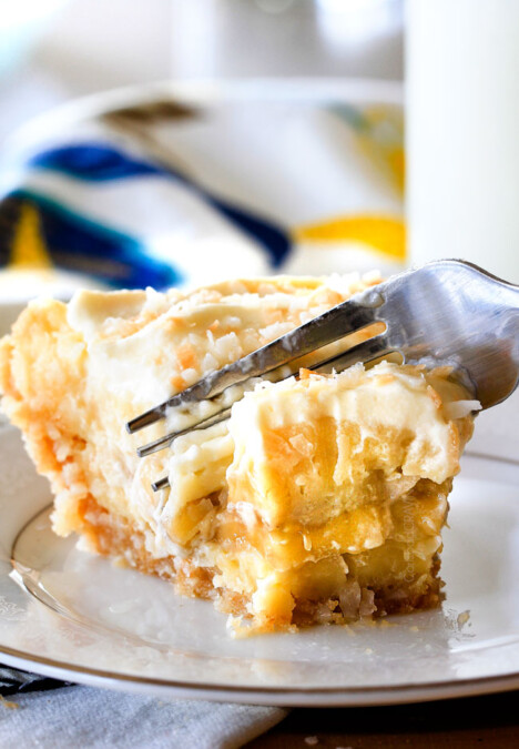 This Banana Coconut Cream Pie is absolutely AMAZING!  Its the best ever banana pie and coconut cream pie mashed together nestled in an easy, Vanilla Wafer Coconut Crust and topped with COCONUT whipped cream!  #thanksgiving #easter