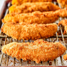 incredibly tender, juicy flavorful Baked Cheddar Ranch Chicken Tenders coated in the most AMAZING cheese cracker breading! These are pure addicting and SO EASY!