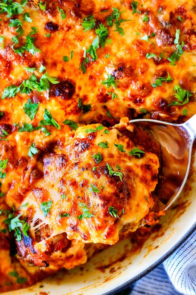 Easy, juicy, flavorful Italian meatballs bathed in rich marinara, smothered in mozzarella and Parmesan and baked to golden cheesy deliciousness! This is one of my favorite recipes EVER and they make the BEST spaghetti and meatballs!