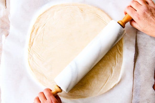 showing how to make pie crust by rolling dough into a circle