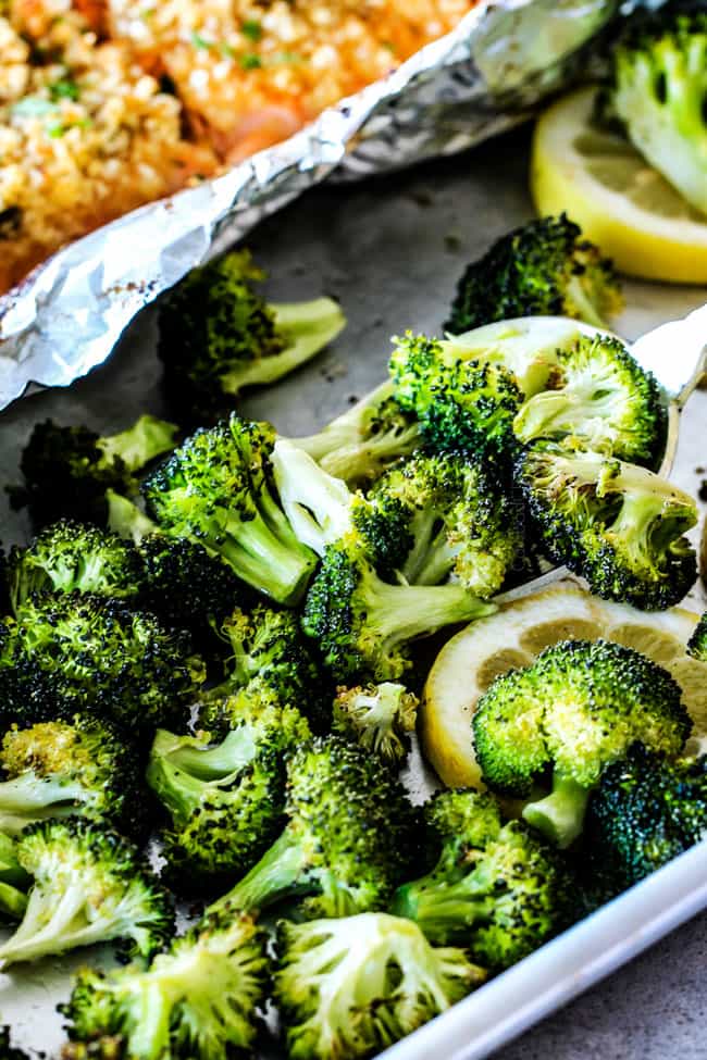 25 MINUTE Baked Lemon Garlic Butter Salmon with Crispy Parmesan Panko & Broccoli! This salmon is not only bursting with flavor and sooo juicy and tender but the easiest, most satisfying meal that tastes totally gourmet! My parents were blown away by this meal! up close of broccoli showing what to serve with oven baked salmon