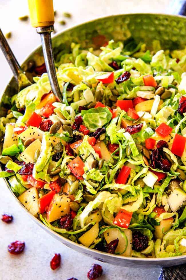 Tossing Cranberry Apple Brussels Sprouts Salad.