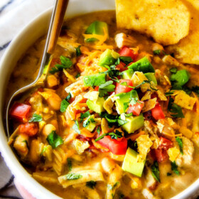 This is the best Slow Cooker Creamy White Chicken Chili I have ever had! Its soooo creamy without heavy cream, so easy, and the layers of flavors are out of this world!