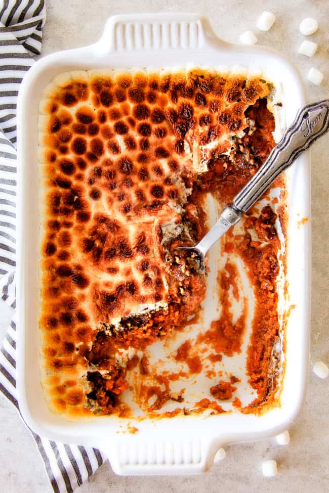 The best ever Sweet Potato Casserole with Marshmallows AND buttery, brown sugar Pecan Topping! This Sweet Potato Casserole has been our favorite recipe ever since we tasted it almost a decade ago and you will love that you can assemble it the night before Thanksgiving or Christmas! No Thanksgiving table is complete without this comforting classic!