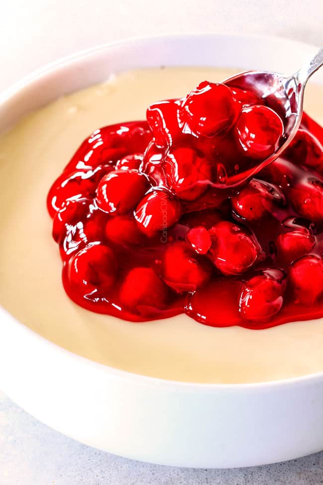 Adding cherries to Cherry Cheesecake Dip.