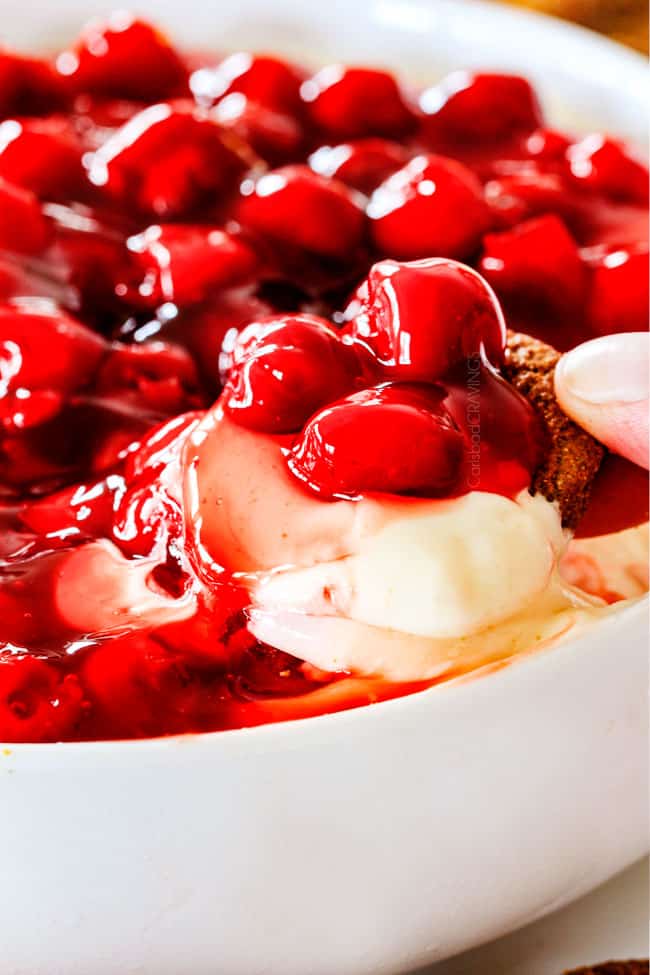 Dipping into Cherry Cheesecake Dip with gingersnap cookies.