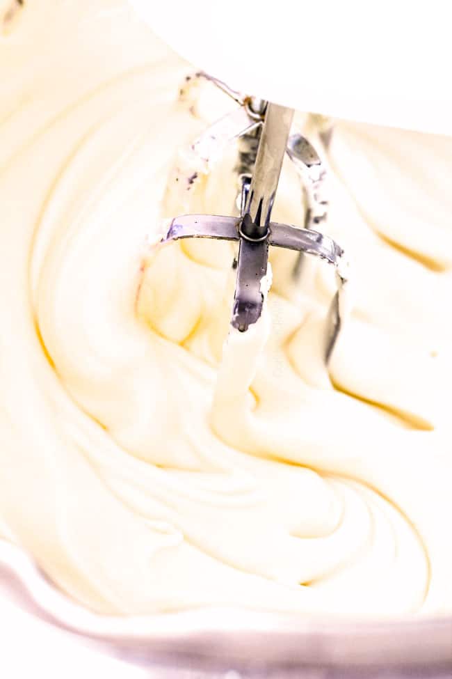 Showing how to make Cherry Cheesecake Dip cream.